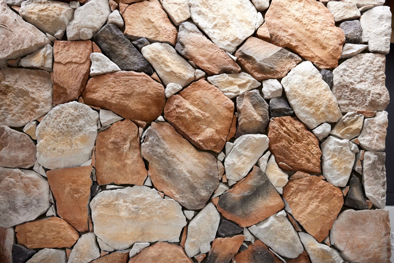 Stone wall on The Block, using Natural Fieldstone in Gilded Sand.